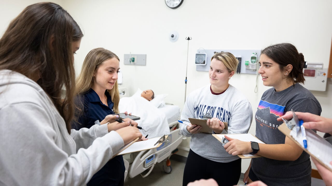 Social work students comparing notes in a simulation exercise.