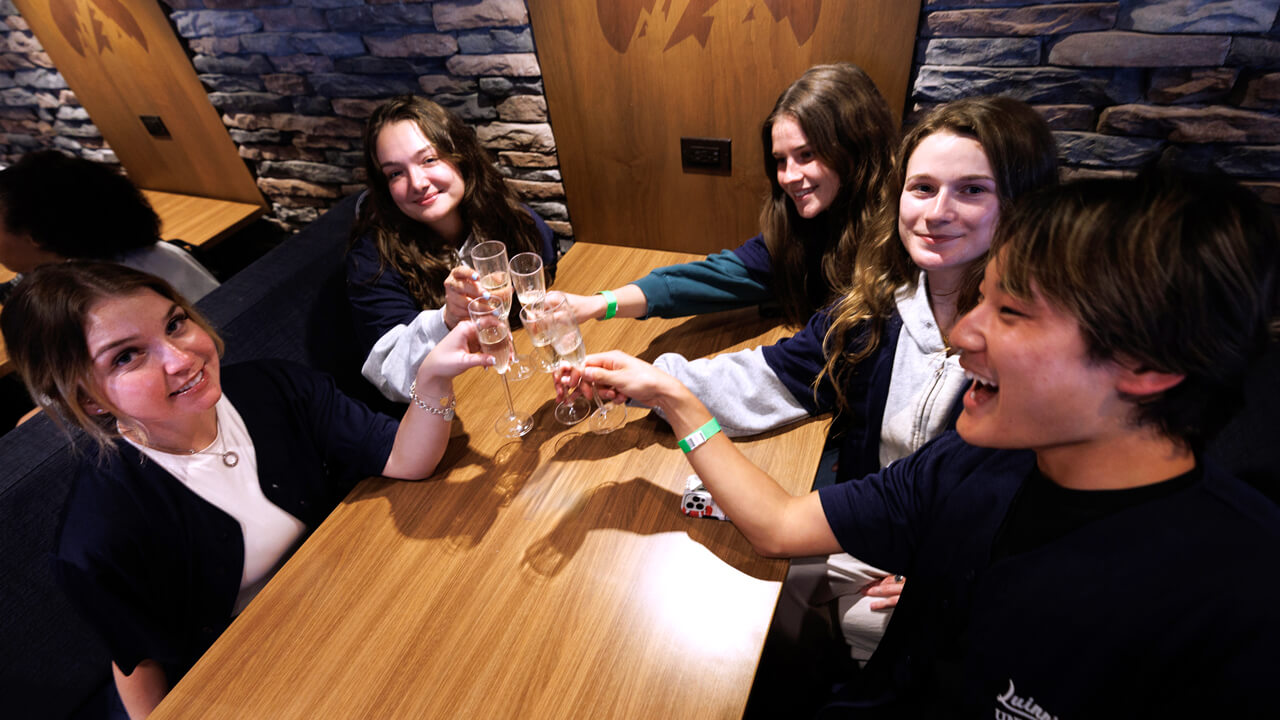 Students toast champagne flutes
