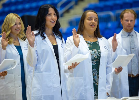 Students reading off a paper